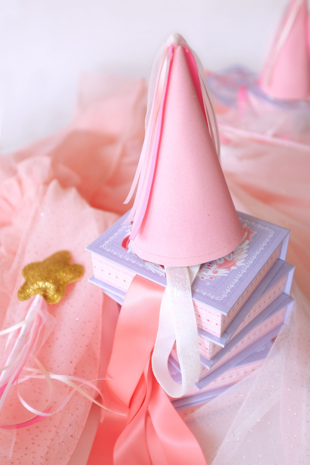 magical sparkly wand and pink party hat