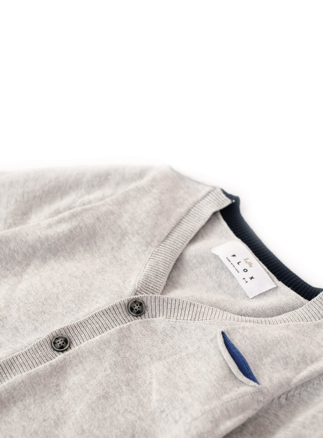 light gray cardigan with elbow patch accent