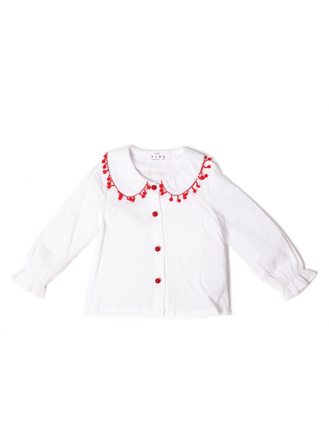 white long sleeve top with mini red heart pompoms