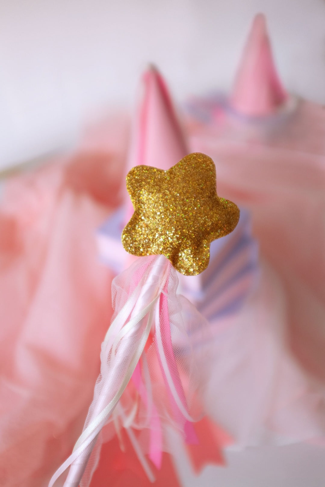 magical sparkly wand and pink party hat