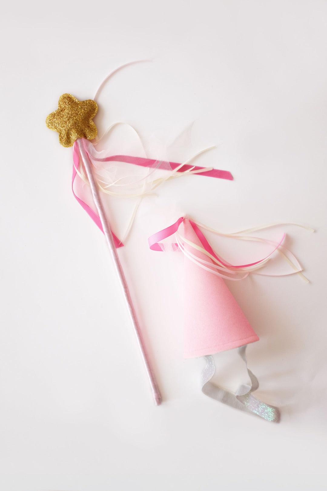 magical sparkly wand and pink party hat
